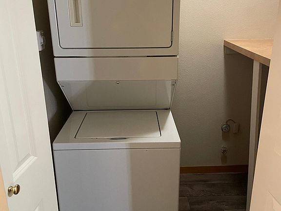 Spacious laundry closet with folding area