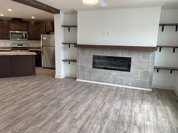 Living Room features Electric Fireplace