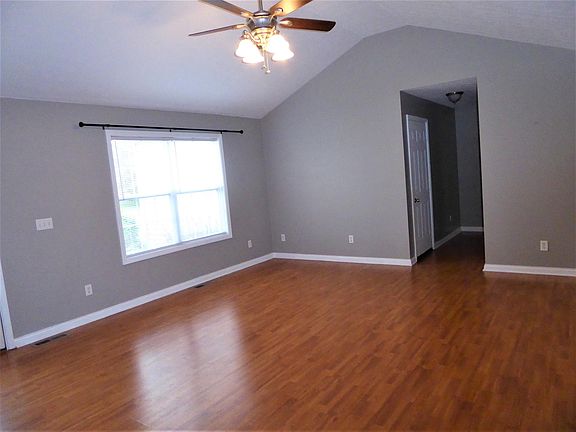 Large Living Room with hallway to master bedroom.