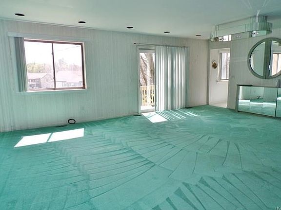 Living room and dining area with slider to balcony