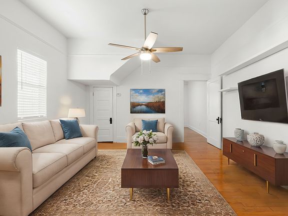 A spacious living room with 10' high ceilings