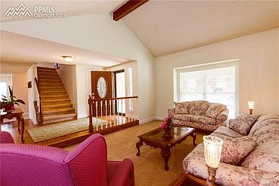 ENTRY SHOT FROM THE LIVING ROOM WITH VAULTED BEAMED CEILINGS