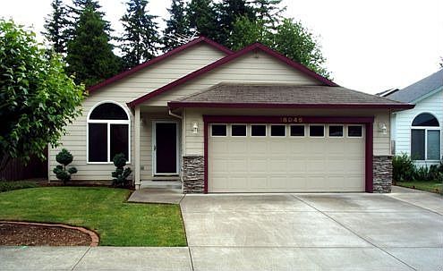 Custom home on street of newer homes.