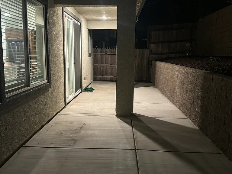 Backyard covered patio (California deck) and flooring with concrete
