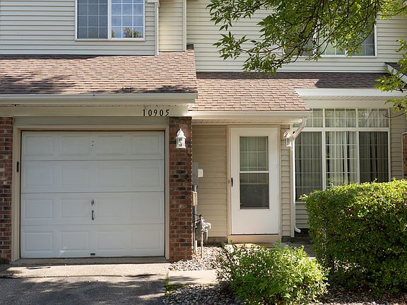 Single car garage, driveway, and front patio space