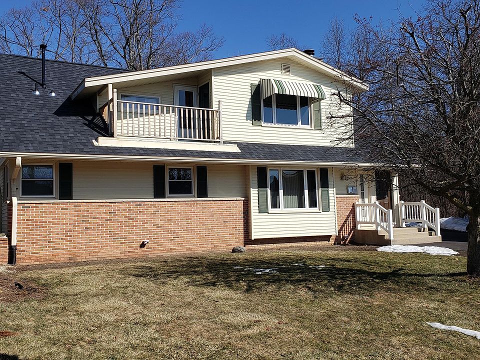 Front of Duplex. Upper unit balcony is shown.