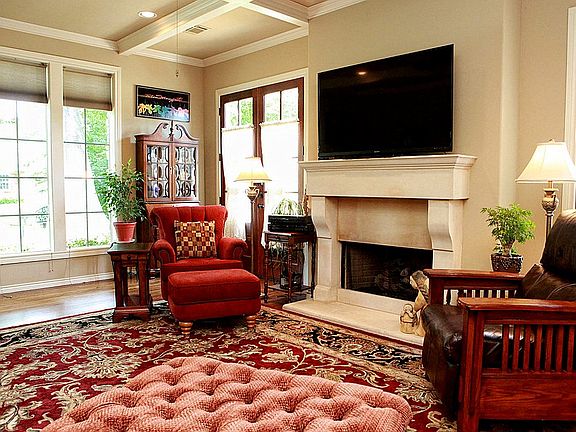 A cast stone fireplace holds gas logs or you can burn wood, if you desire.