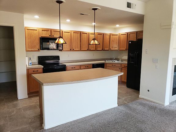 Kitchen and Island. Laundry is through doorway on the left.