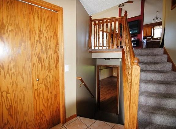 Entry with tile floors and large coat closet.