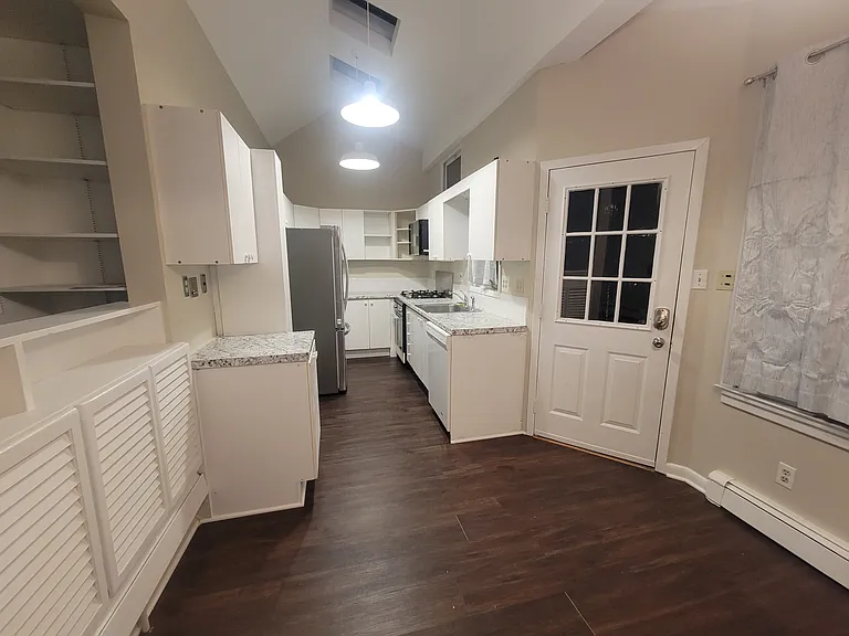 Dining Room and Kitchen plus back exit to parking pic #2