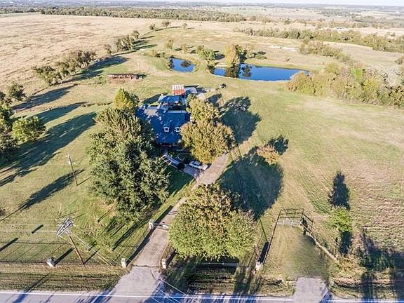 Come home to 10 acres of generous green pastoral views. Gated entrance with driveway.Custom 3 bedroom home with upstairs flex room. 2 stocked ponds. 4 Stall in and out barn. Horses can graze property as they wish. Guest house and workshop.