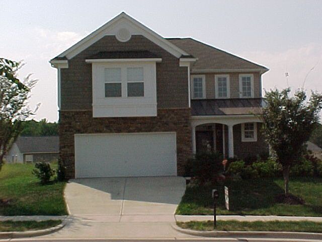 stone front and metal roofing