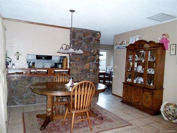 Formal dining area off kitchen and open to living area.