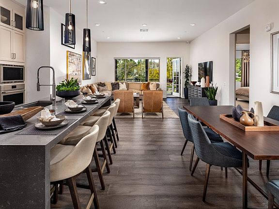 A photo of the kitchen and dining space in the Villas Plan 6 model home in Buena Park, California.