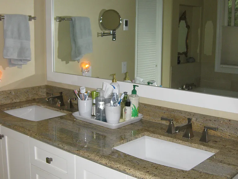 Primary bathroom. Granite countertops.