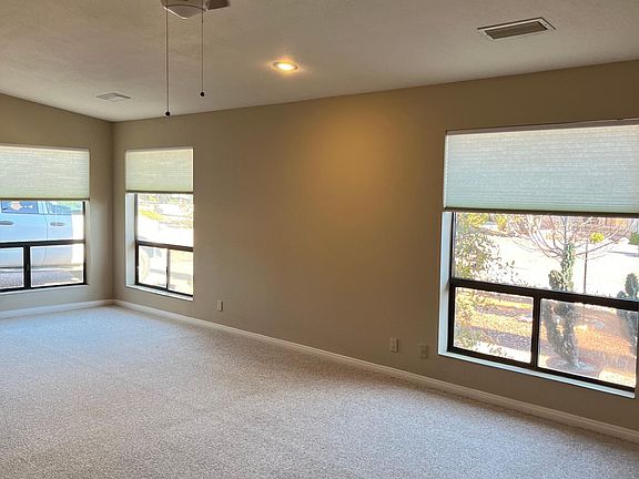 Living room, nice big windows to front yard.
