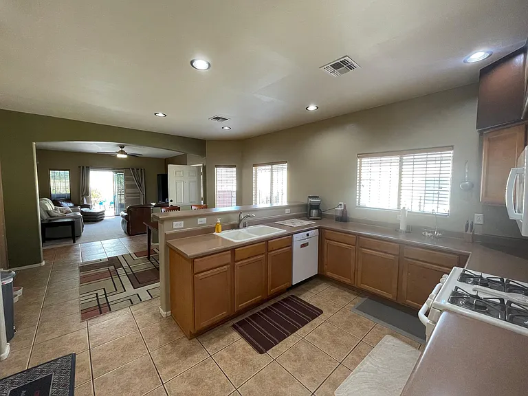 Kitchen looking towards dining room and living room to back yard