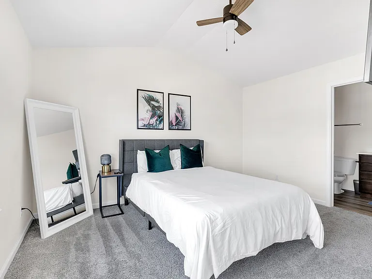 Primary Bedroom with ensuite bath and vaulted ceilings.