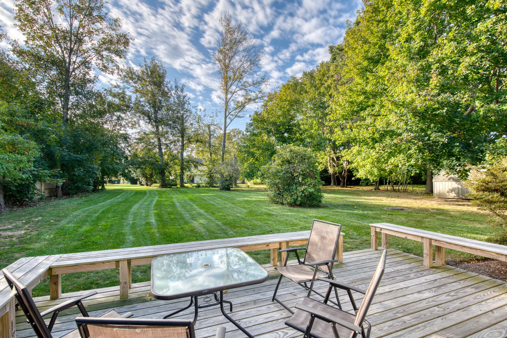 Nice back deck overlooking a private back yard.
