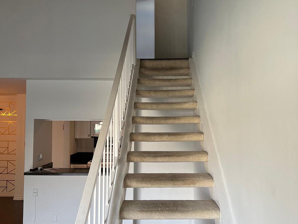 Stairs leading to second bedroom stairs going up
