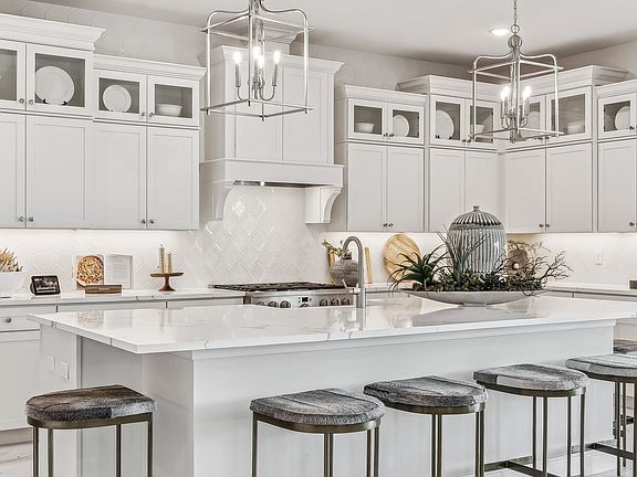 Beautiful upper glass cabinets and quartz countertops