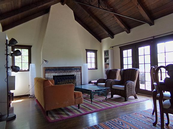 FRONT PORTION OF LIVING ROOM WITH TILED GAS FIREPLACE