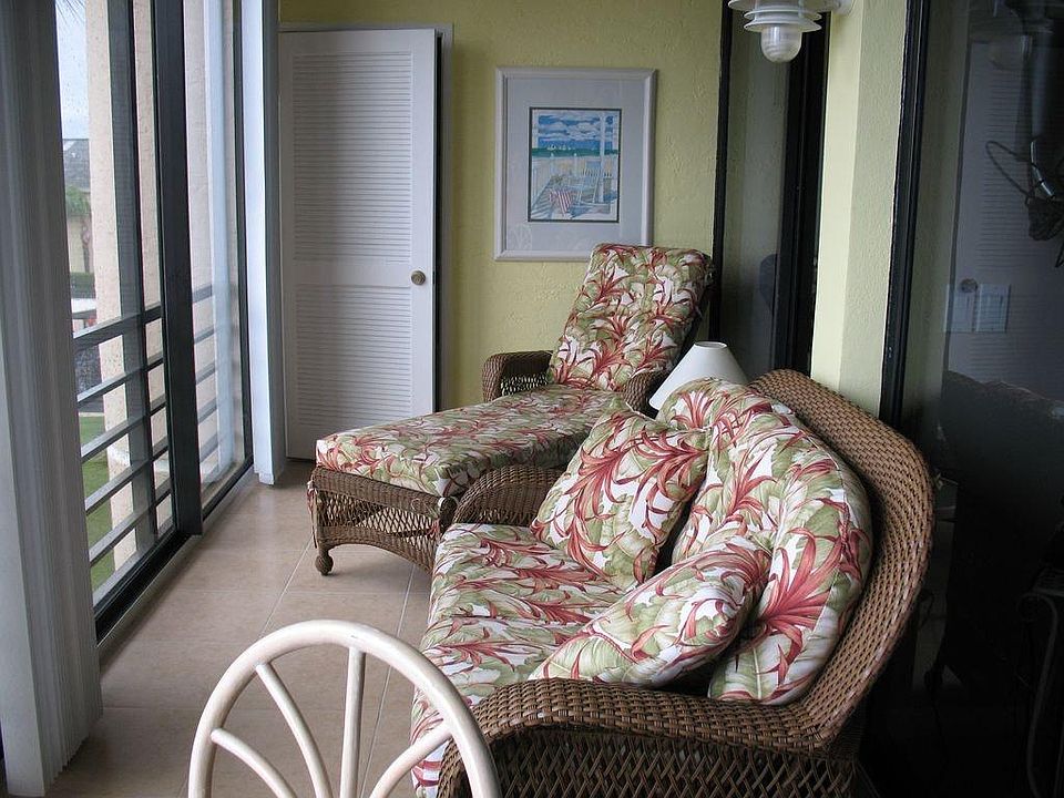 Screened Patio with hurricane glass doors. Comfy coastal furniture with fresh air and beautiful water view!