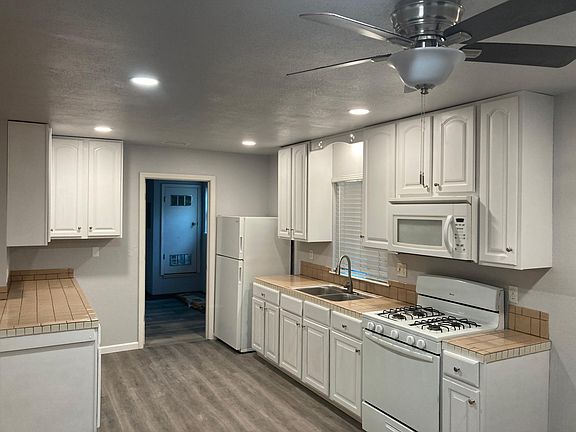 Another view of kitchen and door to Laundry room.