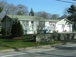 Village ranch accented by Stone Wall