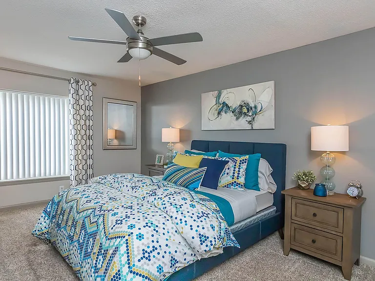 Experience tranquility in this beautifully designed bedroom, complete with modern furnishings and soothing colors.