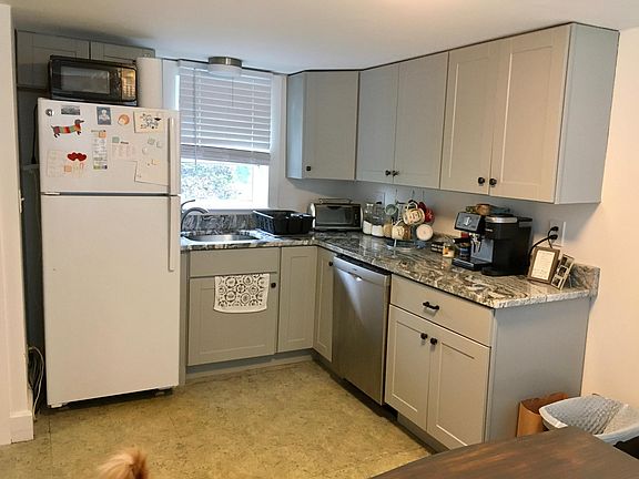 Large eat in kitchen with brand new fridge, dishwasher, cabinets and granite countertops