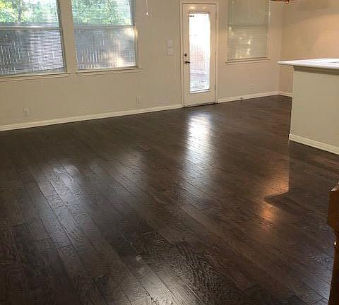 Spacious living area with hardwoods