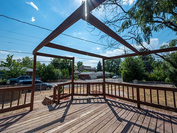Huge fenced back yard and large deck. Partial pergola has been removed. Great sunsets!