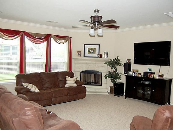 Large family room open to kitchen and breakfast room.  Corner gas fireplace.