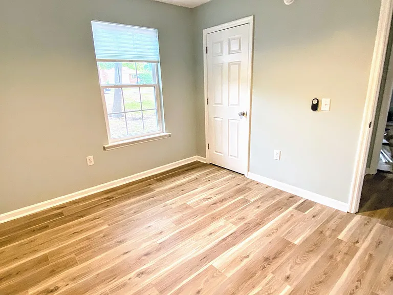 Second bedroom with window facing the front yard.
