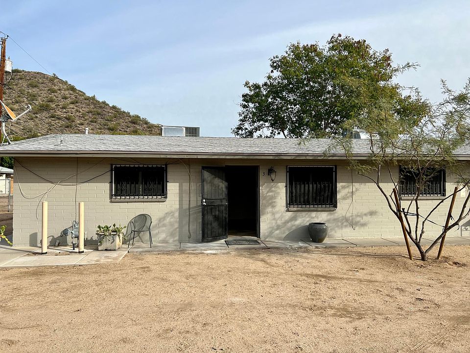 The front door of this peaceful apartment tucked back by the mountains