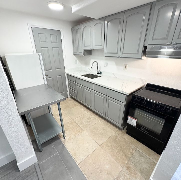 Kitchen with electric stove and oven