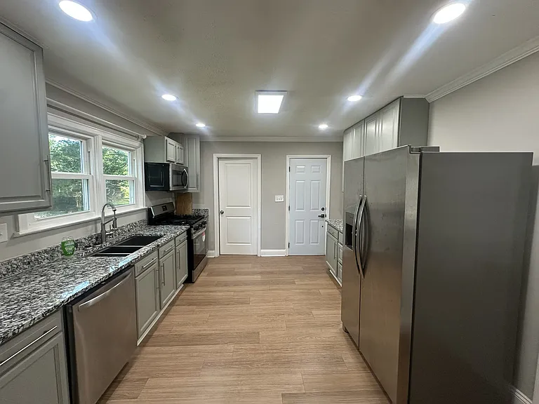 Kitchen (Pantry door on the left, Door to porch on the right)