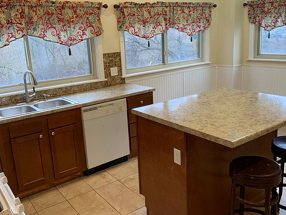 Huge island, dishwasher and plenty of room for a table in the corner