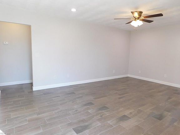 View from the front door toward the right. One large Living Room / Great Room, depending on how it's used.