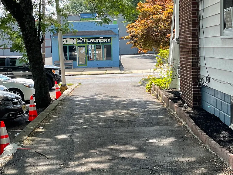 Driveway leading to the dedicated parking at the back of the house