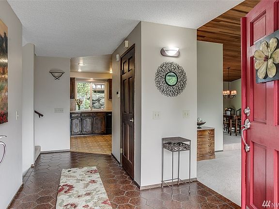 This entrance is warm and welcoming! Love the red double doors. This home has been freshly painted inside.