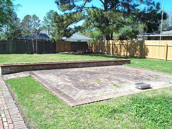 Brick walk & ex-large patio with planter.