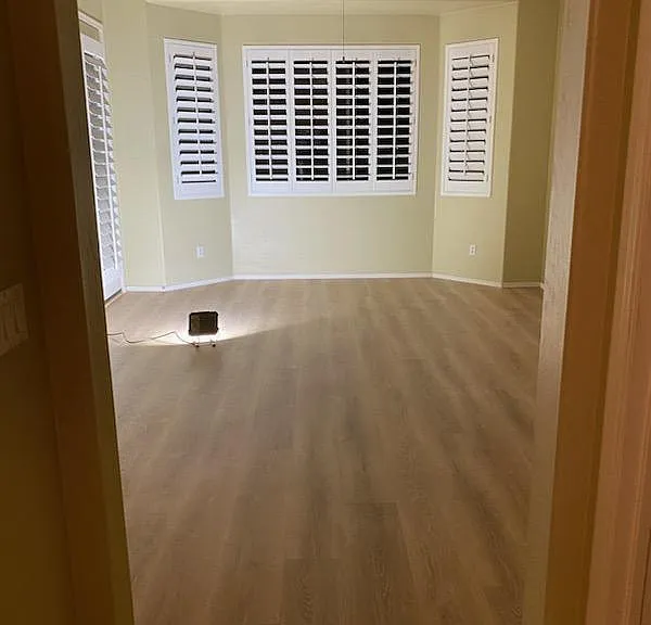 Master bedroom retreat. Brand new L.V.P. flooring, plantation shutters. Picture taken at night on November 13, 2023 standing in bathroom area.