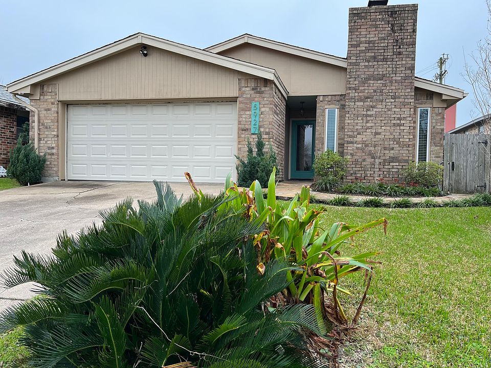 Beautiful brick home with pad & remote automatic garage door opener