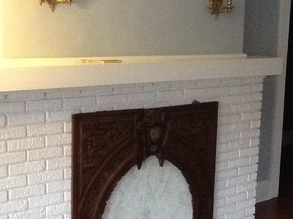 Fireplace decoration not included.