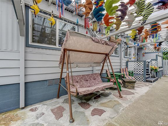 Covered breezeway is a great place to relax during those hot sunny days!