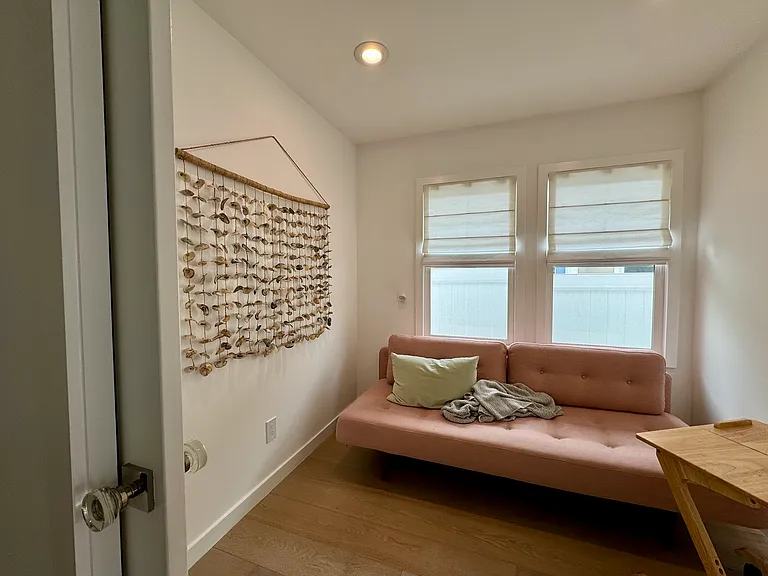 Additional private space can be used as a bedroom (daybed becomes a queen bed) or as a zoom room