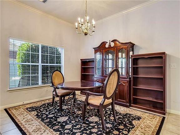 Nice sized dining area is adjacent to kitchen and offers plenty of room for display and storage of c