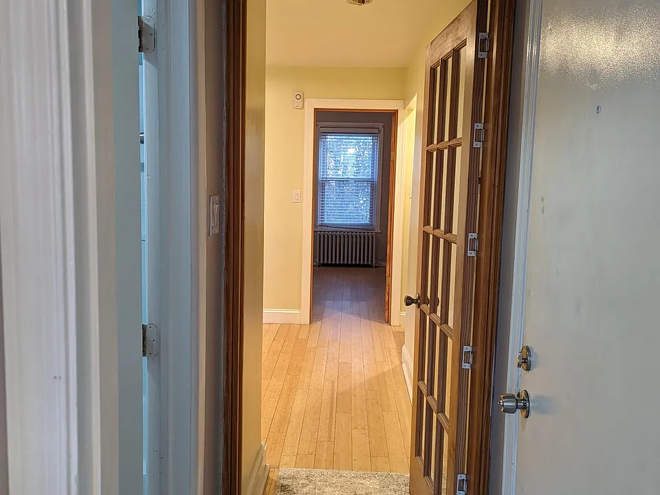 Hall from front door looking past kitchen towards front room.